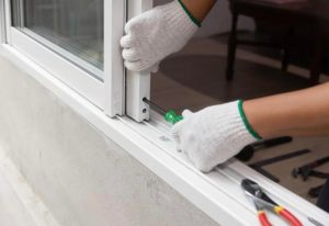 Technician adjusting misaligned sliding door in Lutz FL